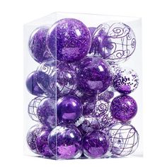 purple and white ornaments in a clear box