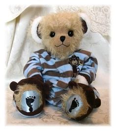 a teddy bear dressed in jail clothes with his paw prints on the chest and feet