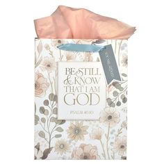 a bag with the words best things and flowers on it, in pink tissue paper