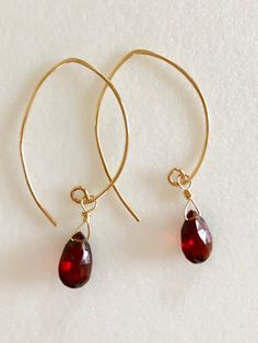 "Stunning rich red Luxe AAA Mozambique garnet earrings in 14k gold fill or Sterling silver. Beautiful 10/11x 7mm faceted rich burgundy red garnet pear briolettes wire wrapped on handmade 14k gold fill ear wires. These garnets are a gorgeous red color, clear and translucent. Total drop length is 1 3/4\"." Gold Garnet Teardrop Earrings, Gold Teardrop Garnet Earrings, Gold Garnet Earrings As Gift, Gold Garnet Dangle Earrings, Yellow Gold Garnet Earrings For Gift, Red Garnet Wire Wrapped Earrings, Elegant Red 14k Gold Filled Earrings, Elegant Red 14k Gold-filled Earrings, Red 14k Gold Teardrop Earrings