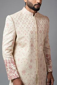 Champagne sherwani with jaal embroidered motifs, sequin and aari, dabka work. Paired with churidar.
Component: 2
Embroidered
Neckline: Mandarin
Sleeve Length: Full
Fabric: Linen Satin, Malai Cotton
Color: Peach
Closure: Concealed buttons
Note: Inner kurta worn by the model is not for sale - Aza Fashions Designer Raw Silk Bandhgala With Chikankari Embroidery, Transitional Bandhgala In Raw Silk With Chikankari Embroidery, Festive Bandhgala With Chikankari Embroidery For Designer Wear, Festive Designer Sherwani With Chikankari Embroidery, Embroidered Straight Kurta Bandhgala For Reception, Formal Nehru Jacket With Floral Embroidery And Straight Fit, Formal Nehru Jacket With Floral Embroidery And Straight Cut, Formal Straight Nehru Jacket With Floral Embroidery, Festive Bandhgala With Zari Work