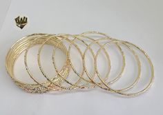 Three Tones Bangles Bracelet. 2.5mm in girth. Available in size: 2.1/4'', 2.5''. Sold by Dozen (12 pc) *Note* BGF=Brazilian Gold FilledBGO=Brazilian Gold Overlay Party Gold-tone Bangle Bracelet, Gold-tone Bangle For Party, Luxury Gold-tone Bangle Bracelet, Luxury Gold-tone Gold Plated Bangle, Gold-plated Bollywood Bangle, Brazilian Gold, Gold Overlay, Laminate, Bangle Bracelets