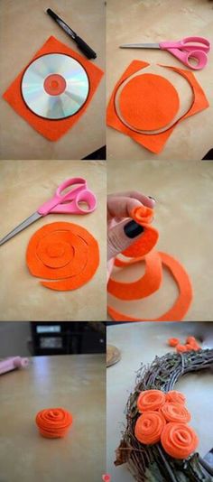 the steps to make an orange flower wreath with scissors and tape on top of it