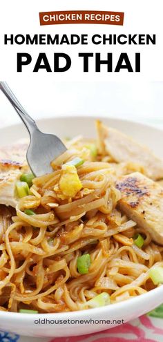 chicken pad thai noodles in a white bowl with a fork