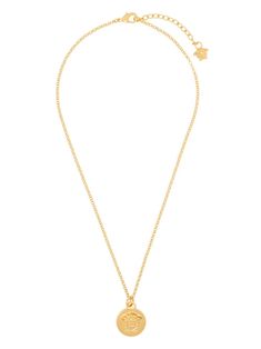 Elegant Gold-tone Necklace With Logo Charm, Gold-tone Metal Chain Necklace With Logo Charm, Classic Gold-tone Brass Necklaces, Gold-tone Pendant Medallion Necklace, Elegant Gold-tone Chain Necklace With Logo Charm, Gold Chain Necklace With Gold-tone Logo, Gold Chain Necklace With Logo Plaque, Gold-tone Plated Jewelry With Logo Plaque, Elegant Pendant Chain Necklace With Logo Charm