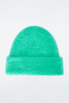 Offered in a fresh turquoise hue, this cozy beanie is knitted from a traceable mohair blend that's been certified by the Responsible Mohair Standard. It's ribbed to keep warmth in and has a soft, fuzzy hand feel and a wide fold-up brim. Certified by the Responsible Mohair Standard, to protect the welfare of the goats and their environment 72% RMS Mohair, 26% Polyamide, 2% Elastane Fold-up length: 3.34" Mohair Beanie Pattern, Mohair Beanie, Belted Cape, Turquoise Scarf, Cozy Beanie, Mohair Scarf, Land Management, Modern Shoes, Accessories Bags Shoes