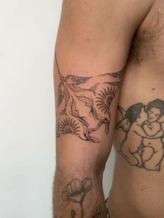 a man's arm with tattoos on it and an image of a woman holding a baby