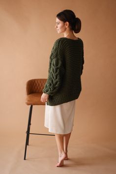 "Meet green chunky knit cardigan! Beautiful delicate green chunky sweater with braids! Cozy and stylish. Unique designed long sleeves. Soft and cozy finest quality green bomber jacket for woman. Wedding cover up is a unique piece for a cold wedding day that will keep you warm and make your look magical. A completely weightless wedding sweater, wraps you in a warm cloud. This is the perfect solution for autumn and spring, will make your look feminine and light. The pattern is so interesting that Green Wool Knitted Cardigan, Green Cable Knit Cardigan For Fall, Green Long Sleeve Cable Knit Sweater Coat, Winter Green Cable Knit Cardigan, Green Cable Knit Long Sleeve Sweater Coat, Green Cable Knit Sweater Coat With Long Sleeves, Green Long Sleeve Chunky Knit Pattern, Green Chunky Knit Long Sleeve Knitting Pattern, Green Cable Knit Sweater Coat