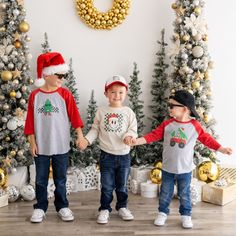 The Santa Smiley Christmas Long Sleeve Shirt is a fun and festive shirt for kids celebrating Christmas! Features: Shirt Color: Natural Heather Graphic Color: Red, Green, Black Material: 100% Cotton Features: Tagless inside neck label for an itch-free wear Fit: Toddler Unisex; True to Size Care: Machine washable, tumble dry low, wash with like colors Each t-shirt is hand pressed with love using baby and child safe inks. Smiley Christmas, Christmas Long Sleeve Shirts, Hat For Kids, Celebrating Christmas, Baby Boy Onesies, Boy Onesie, Festival Shirts, Neck Label, Snap Back