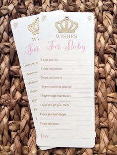 a wicker basket filled with lots of baby shower games and wishes for the baby