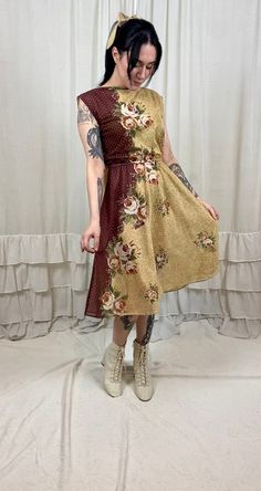 "This super sweet 70's cream and brown floral swiss dot dress is just darling! In great vintage condition, this dress is the perfect summer to fall transition piece. It is quite sheer and could be worn with a slip or a bodysuit, if desired. i believe this dress would best fit a modern size small to medium. it allows for stretch in the waist due to an elastic waistband. Measurements (Measurements were taken with the garment laying flat. Double the measurements). Marked Size: N/A Bust: 17\" Waist: 10.5\"-15\" Hips: full Length: 31\" Model Measurements: Bust: 34\" Waist: 24\" Hips: 35\" This dress fit Brittany well. She normally wears a modern size XS to S and this dress fit her super cute and looked darling on her." Bride Of Chucky Halloween, Thrift Flips, Swiss Dot Dress, Bride Of Chucky, Flair Dress, Fall Transition, Summer To Fall, Swiss Dot, Brown Floral