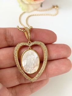 Virgen de Guadalupe Necklace MATERIAL AND SIZE Mother of pearl connector Cubic zirconia 18k gold plated Pendant size: 3.5cmx3cm If you have questions about the product, feel free to reach me out. Don't forget to check out my other items in the store: Https://www.etsy.com/shop/nyahwithlove Miraculous Medal Jewelry Gift For Mother's Day, Miraculous Medal Pendant Jewelry For Wedding, Spiritual Miraculous Medal Necklaces For Anniversary, Mother's Day Gift Jewelry With Miraculous Medal, Wedding Miraculous Medal Pendant Jewelry, Miraculous Medal Wedding Pendant Jewelry, Miraculous Medal Pendant For Wedding, Miraculous Medal Necklace For Mother's Day Gift, Wedding Miraculous Medal Pendant