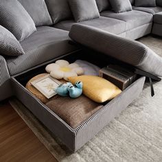 a couch that has some pillows in it