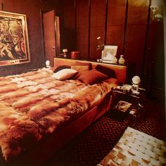 a large bed sitting in a bedroom next to a painting