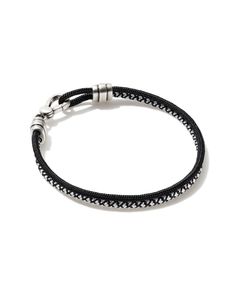 a black leather bracelet with silver beads