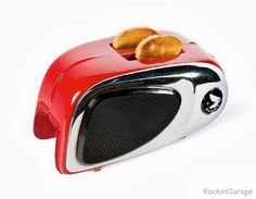 a red toaster with two slices of bread on it's front and side