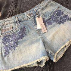 Calvin Klein Jeans Denim Highrise Shorts Size 28, Cutout And Embroidered, Silver Tone Embellishments, Light Wash, Small Fringe Hem Length - Approximately 11-1/2” - 12” Rise - Approximately 11” Waist - Approximately 15” Flat Brand New With Tags Embroidered Medium Wash Denim Jean Shorts, Embroidered Denim Blue Jean Shorts, Embroidered Denim Jean Shorts In Blue, Blue Embroidered Jean Shorts, Embroidered Medium Wash Denim Shorts, Embroidered High Rise Denim Shorts, High-rise Embroidered Denim Shorts, Blue Embroidered Denim Shorts, Blue Embroidered Short Length Jeans