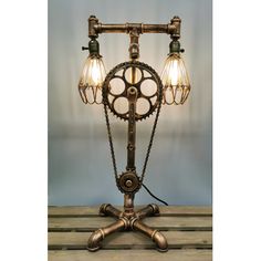 an old fashioned lamp with three lights on it