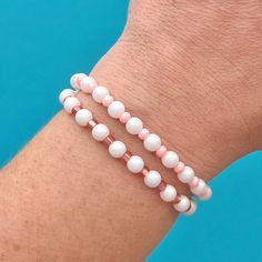 To get the most comfortable size:  Measure wrist at the widest point and add .25-.5 inches, depending on desired fit. *Please note: Elastic string will break or stretch if over-stretched or handled roughly!  Do not get wet! Feel free to contact me with any questions or requests! White Beaded Stretch Bracelets, Flexible White Bracelets For Summer, White Flexible Casual Bracelet, Flexible White Bracelets With Colorful Beads, Flexible White Beaded Friendship Bracelet, Handmade White Beaded Flexible Bracelets, Casual White Flexible Bracelet, Flexible White Beaded Stretch Bracelet, Adjustable Pink Pearl Stretch Bracelet