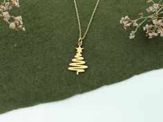 Christmas Tree Necklace in 14K Solid Gold, Gold Pine Tree Pendant, Dainty Charm Necklace, Noel Gifts, Christmas Gift Jewelry, Xmas Necklace -Features- * Made to order * Material: Solid Gold (no gold filled or gold plated material) * Carat: 14K (585) (real gold) * Production Techniques: Handmade and Laser Cut * Package: Jewelry Box This beautiful 14K Solid Gold handmade necklace is the ideal gift for a loved one. Perfect for birthdays, anniversaries, Mother's Day, Christmas and weddings, it truly is extra special and will make whoever receives it feel extra special too.  / WHY YOU'LL LOVE / * Elegant and can be worn every day * A special piece that you can appreciate * High quality 14K Solid Gold and attention to detail Hallmark Necklace For Christmas And Anniversary, Quality Assured Necklace For Christmas Anniversary, Gold Necklaces For Christmas Celebration, Gold Necklace For Christmas Celebration, Christmas Celebration Yellow Gold Jewelry, 14k Gold Necklace As Christmas Gift, 14k Gold Necklace For Christmas Gift, Yellow Gold Necklaces For Christmas Anniversary, Yellow Gold Necklace Christmas Gift