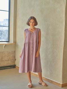 "PRODUCED in 3-5 days FAST & FREE shipping with DHL Express Courier -10% for all items with code \"FAVOURITE\" Made from pre-washed soft linen in a subtle lavender color with a light purple hue, this dress is for your natural charm. A v-neck, slightly emphasized waist and buttons at the front will make your outfit romantic and comfortable.  Details: - 100% Linen - Pure linen fabric - V neck - Flared silhouette  - Slightly emphasized waist - Two side pockets - Buttoned front - Above knee length - Comfortable fit - Model's height is 160 cm / 5'3'' wears size M - Code: E9021-L532-125 The dress is available in other colors. You can find them in the gallery. If you want to order the dress in another color, please specify it in the personalization field. Sizing: This garment is true to size, and Summer Purple Dresses With Pockets, Casual Purple Midi Dress For Daywear, Sleeveless Mauve Midi Dress For Spring, Casual Purple A-line Midi Dress, Lavender Sleeveless Day Dress, Lavender Sleeveless Dress For Daywear, Mauve Knee-length Midi Dress For Summer, Casual Lavender Knee-length Midi Dress, Purple Sleeveless Midi Dress For Spring