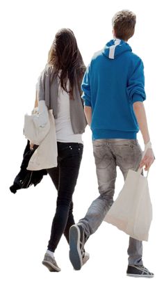 two people walking down the street carrying shopping bags