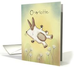 a card with a dog flying through the air on it's back and saying charlotte