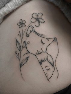 a woman's stomach with a drawing of a mother and her child on it