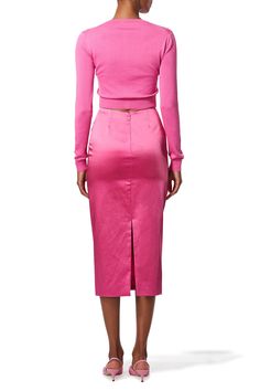 Carolina Herrera long sleeve cardigan in rose. 55%SE 45%CO Dry Clean Made in China Elegant Pink V-neck Cardigan, Chic Pink V-neck Cardigan, Feminine Pink Long Sleeve Cardigan, Feminine Fitted Long Sleeve Cardigan, Fitted Long Sleeve Feminine Cardigan, Elegant Pink Winter Cardigan, Pink Long Sleeve Cardigan For Workwear, Chic Pink Sweater For Work, Pink Long Sleeve Sweater For Work