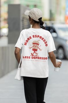 More Espresso Less Depresso Shirt, Retro Coffee Tshirt, Vintage Style Graphic Tee with a two-part design on the front and back, featuring a retro coffee cup. Order a size or two up for an oversized look.  We Offer Free UK Delivery! NOTE TO OUR CUSTOMERS We are a new business and very much appreciate your support! If you love your Tee as much as we hope you do, please leave us a review, thank you in advance- stay cosy and stay groovy! 💚 HOW TO ORDER 💚 1. Check our photos for sizing and colour o More Espresso Less, Stay Groovy, Style Graphic Tee, Retro Coffee, Oversized Look, Coffee Lover Gift, Coffee Shirt, Coffee Tshirt, Coffee Shirts