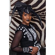 Our Xhosa Beaded Head Wrap will have you standing tall with pride. This head wrap is handmade out of soft black fabric and showcases white glass beads and white buttons that are individually stitched in by hand. These head wraps are part of the traditional Xhosa women's wear and can be styled many different ways. Measurements: 59" W x 26" L - one size fits most Doek Styles, Xhosa Culture, Headwrap Styles, Outfit Traditional, Xhosa Attire, South African Traditional Dresses, Triangle Head, Beaded Clutch Bag, African Accessories