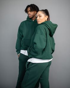 Made from the same soft material as our blank hoodies, these sweatpants feature a relaxed fit, welt hand pockets, and elasticized cuffs. 100% Cotton Elasticized waistband with drawstring Model is 6'1 wearing size L Hooded Sweats With Ribbed Waistband For Loungewear, Relaxed Fit Hooded Sweats For Leisure, Green Winter Sweatpants For Leisure, Oversized Fleece Sweatpants Athleisure, Oversized Fleece Sweatpants In Athleisure Style, Green Athleisure Sweats With Drawstring Hood, Oversized Fleece Sweatpants For Athleisure, Green Drawstring Hood Sweats For Athleisure, Casual Fleece Tracksuit With Pockets