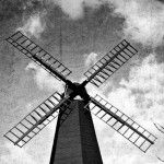 a black and white photo of a windmill