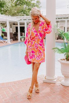 - Pack this cutie for your next vacay! A flirty deep-v neck and vibrant floral print create a look perfect for tropical style. A relaxed yet flattering silhouette that ends in a mini dress length hemline. - Unlined material with a cream, purple, and pink hued abstract floral print - A deep-v neckline - Short loose sleeves - An elastic waistline - A relaxed silhouette that ends in a mini dress length hemline Measurements S : Bust 28", Hip 32", Length 34", Sleeve Length 18.5", Waist 22-26". M : Bu Tropical V-neck Beach Dress For Day Out, Flowy Tropical V-neck Dress, Flowy V-neck Tropical Dress, Tropical V-neck Mini Dress For Beach, V-neck Tropical Print Beach Dress For Vacation, Vibrant Floral Print V-neck Mini Dress, Flowy V-neck Beach Dress With Tropical Print, Tropical V-neck Mini Dress For Brunch, Tropical V-neck Beach Dress For Spring