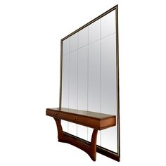 a mirror sitting on top of a wooden shelf