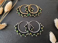 Elegant handwoven hoops with fire-polished Czech beads and Miyuki Delica Option 1 : Black/green & brass Option 2 : Black/green & sterling silver These beaded hoop earrings were designed to match the Coburn bracelets - both the hoop earrings and the bracelet are available as a jewelry set in my shop. I used a number of high-quality seed beads and fire-polished glass beads of well-known glass bead manufacturers for this design. The filled herringbone stitch was woven with resilien beading thread s Handmade Black Hoop Jewelry, Handmade Green Hoop Earrings For Gift, Handmade Black Hoop Earrings Gift, Handmade Adjustable Green Hoop Earrings, Adjustable Handmade Green Hoop Earrings, Festival Green Hoop Earrings, Handmade Green Beaded Hoop Earrings, Green Hoop Earrings For Festivals, Handmade Black Beaded Small Hoop Earrings