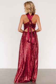 This eye catching dress is designed to make you dazzle at any occasion All burgundy color Sequins throughout tulle material Criss cross gathered halter neckline Pleated tank sleeves Open back style with zipper Criss cross straps with tie detail at back Fitted bodice with flowing maxi skirt Fully lined Self and Lining: 100% Polyester Contrast: 97% Polyester, 3% Spandex Trina is 5'6, cup size 32D, size 2 and is wearing size S Tie Back Evening Dress For Prom Season, Tie-back Evening Dress For Prom, Prom Season Evening Dress With Tie Back For Party, Prom Season Party Evening Dress With Tie Back, Prom Season Party Dress With Tie Back, Glamorous Evening Dress With Tie Back, Glamorous Tie Back Halter Dress For Prom, Glamorous Tie-back Halter Dress For Prom, Tie-back Dress For Prom Season Party