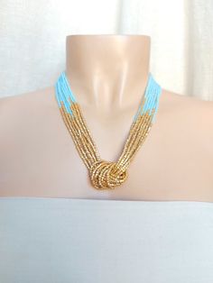 "This unique mint green and gold necklace is a little more regal and elegant than my usual designs. The gold detail made with hexagon seed beads make the light reflect very nicely on the necklace.  It has 8 strands. Matching earrings sold here: https://www.etsy.com/listing/218792281/light-gold-beaded-earrings-gold . More items in mint color: https://www.etsy.com/shop/StephanieMartinCo?ref=seller-platform-mcnav&search_query=mint Please read specifications on SIZES below: ❤ SIZES This item comes in several sizes, kindly choose at checkout. The easiest way to find out which length suits you best is to measure a necklace you already own, from one end to the next, including clasp. You can also use the diagram on the pictures as a reference, but keep in mind that we all have different neck and b Gold Necklaces With Colorful Beads For Wedding, Elegant Turquoise Beaded Necklaces With Gold Beads, Elegant Turquoise Beaded Necklace With Gold Beads, Green And Gold Necklace, Gold Bead Earrings, Green Beaded Necklace, Wedding Bridesmaid Jewelry, Mint Gold, Summer Necklace