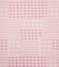 a pink rug with squares on it