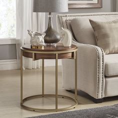 a living room scene with focus on the end table and sofa in the foreground