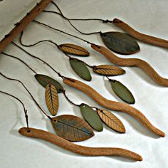 a group of wooden leaves hanging from a wall