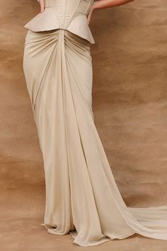 Beige draped skirt with a trail. Paired with a criss-cross padded halter neck corset style blouse. - Aza Fashions Pre-draped Flowy Skirt, Fitted Long Draped Skirt With Folds, Halter Neck Corset, Beige Drapes, Neck Corset, Corset Blouse, Beige Skirt, Women Skirt, Draped Skirt