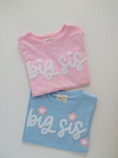 Sisters! We love this big sister t-shirt and think it's the perfect way to include older siblings in baby announcements! These are also sweet for lil sis and big sis matching gifts. Matching big brother, little bro, and little sis bodysuits and sweatshirts are available too! Design Options Include: - big sis - lil sis - middle sis - big sister - big bro - lil bro - middle bro - big brother ---- DETAILS: - This listing is for one custom embroidered t-shirt. Each item is made-to-order. If you are ordering more than one item, please add each item to your cart.  - All letters will be lowercase on these designs unless requested otherwise when placing your order. - Felt is hand-stitched with matching thread unless otherwise requested.  - If you'd like to customize this, please message me before Cute Long Sleeve T-shirt With Embroidered Text, Cute Crew Neck Top With Embroidered Text, Family Matching White T-shirt With Embroidered Text, White Family Matching T-shirt With Embroidered Text, Cute Short Sleeve Top With Embroidered Text, White Embroidered T-shirt For Family Matching, Cute Pink T-shirt With Letter Embroidery, Cute Cotton Tops With Embroidered Text, Cute White Tops With Letter Embroidery