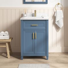 The Lancashire vanity from allen + roth is the perfect choice for anyone looking to add a contemporary twist to their powder room or small bathroom. Featuring details like chambray blue painted finish and brushed gold hardware, this piece works with many decor styles. Ideal for compact spaces, its 2-door cabinet and tilt-down drawer provide ample storage to stash your products out of sight. An undermount sink and sleek white engineered stone top complete the look of this on-trend yet timeless va Coastal Bathroom Vanity, Powder Room Redo, Small Half Bathroom, Organic Modern Bathroom, Light Blue Bathroom, 24 Inch Bathroom Vanity, Blue Bathroom Vanity, Tiny Bath, Blue Vanity