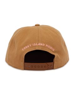 As seen on Hailey Bieber. Adjustable snapback baseball cap with Montauk embroidery at the front. Paneled fabrication finished with a flat brim. Circumference: Adjustable Unisex COLOR VARIATIONS: Ivory w/ Teal & Blue Embroidery Hot Pink w/ White Embroidery Cream w/ Green & Gold Embroidery Red w/ Orange and White Embroidery Light Brown w/ Cream & Pink Embroidery Black w/ White & Gold Embroidery Return Policy Shipping Policy Adjustable Trucker Hat With Embroidered Logo And Flat Brim, Brown Snapback Baseball Cap With Embroidered Logo, Embroidered Logo Flat Cap For Baseball Season, Summer Baseball Cap With Embroidered Logo And Flat Brim, Brown Flat Bill Baseball Cap, Brown Flat Bill Baseball Cap For Streetwear, Brown Snapback Hat With Embroidered Logo And Flat Brim, Brown Snapback Hat With Embroidered Logo And Flat Bill, Brown Flat Brim Snapback Hat With Embroidered Logo