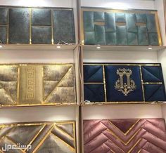 several different colors and designs on display in a store front window with gold trimmings