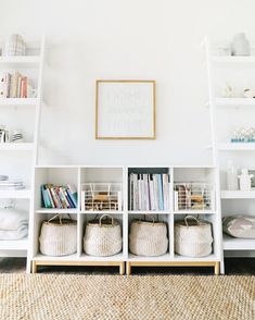 white shelves with baskets and books on them