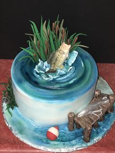 there is a cake that looks like it has a fish in the water