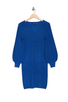 Dramatic balloon sleeves frame this modern sweater dress that is sure to get compliments wherever you go! . V-neck. Long balloon sleeves. Slips on over head. Knit construction. Short length. Approx. 38" length (size S). Imported    Machine wash cold 72% rayon, 28% polyester Blue Lantern Sleeve Dress For Fall, Casual Long Sleeve Puff Sleeve Dress For Fall, Blue V-neck Dress With Elastic Sleeves, Casual Blue Puff Sleeve Dress With V-neck, Chic Blue V-neck Puff Sleeve Dress, Casual Blue V-neck Puff Sleeve Dress, Chic Blue Puff Sleeve V-neck Dress, Blue V-neck Sweater Dress For Spring, Blue Knit V-neck Dress