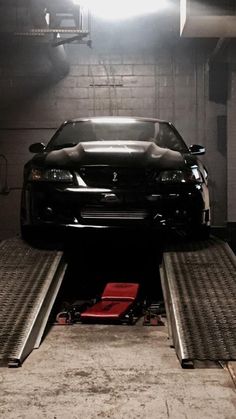 a car is being loaded onto the back of a truck